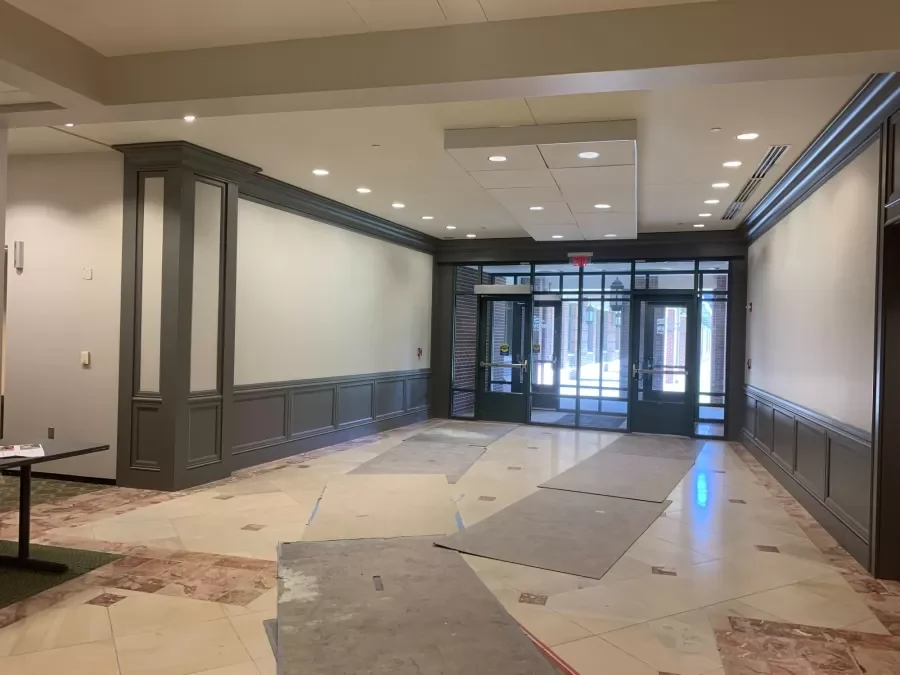Entrance corridor at Aspiria Campus during renovation. Painted walls and paneling before flooring is complete.