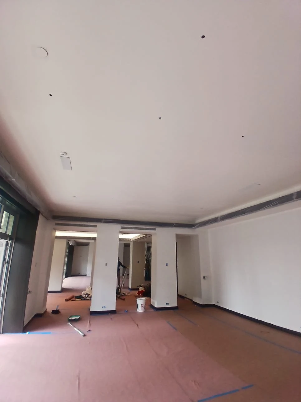 Protection continues through adjoining rooms as work moves across the home.